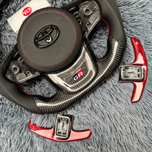 Cargar imagen en el visor de la galería, Volante de fibra de carbono TTD Craft para Toyota Supra MK5 A90 A91 (2020-2025)