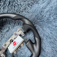 Cargar imagen en el visor de la galería, TTD Craft Nissan 2015-2024 Volante de fibra de carbono Titan