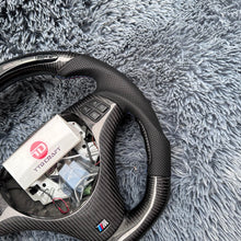 Load image into Gallery viewer, TTD Craft 1 SERIES E82 E88 / 3 SERIES E90 E91 E92 E93 / X1 E84 Carbon Fiber Steering Wheel