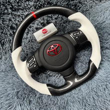 Lade das Bild in den Galerie-Viewer, TTD Craft Toyota 2006-2017 FJ Cruiser Carbonfaserlenkrad