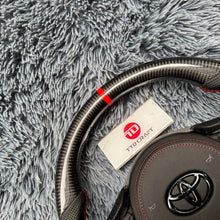 Cargar imagen en el visor de la galería, Volante de fibra de carbono TTD Craft para Toyota Supra MK5 A90 A91 (2020-2025)
